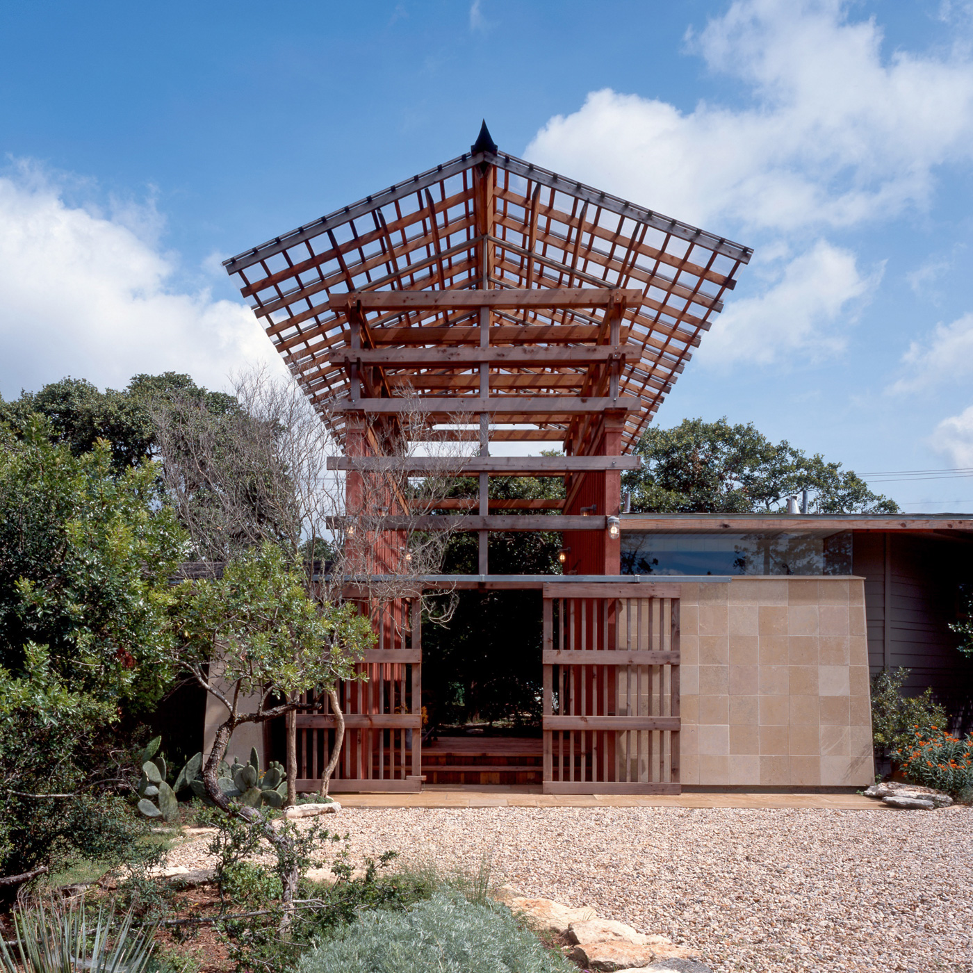 A house's central wooden raised awning system.